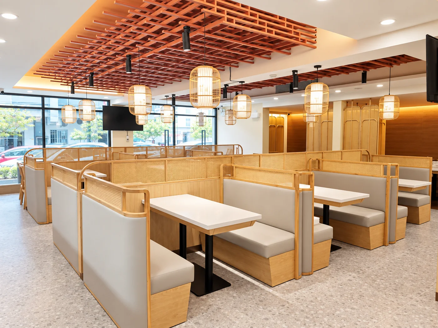 Light wood restaurant tables and booth seating