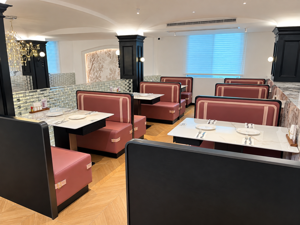 Western restaurant booth seating and dining table arrangement for commercial dining space.
